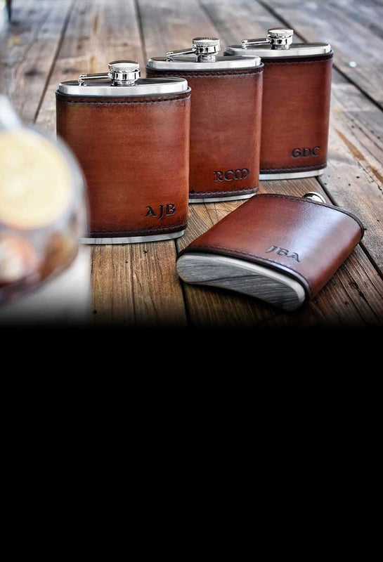 Leather wrapped flasks personalized with hand stamp initials. An excellent choice for your groomsmen gift, father's day, birthday, graduation, or any of life's special moments.