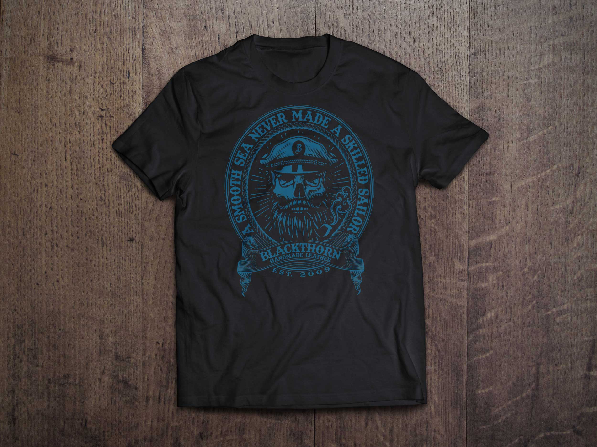 Flatlay of t-shirt featuring "Smooth Seas" artwork